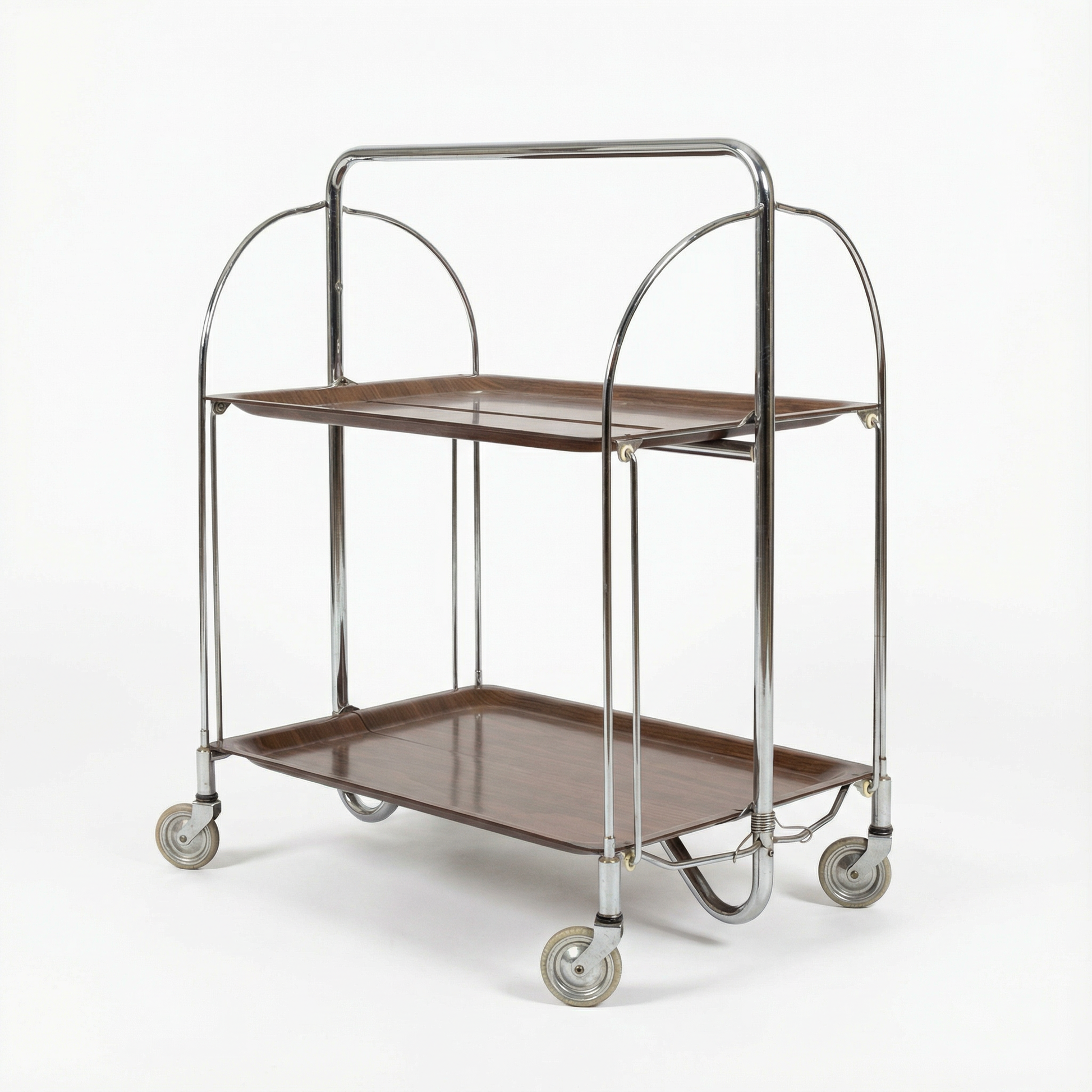 Two-tiered metal serving cart with wheels on a white background