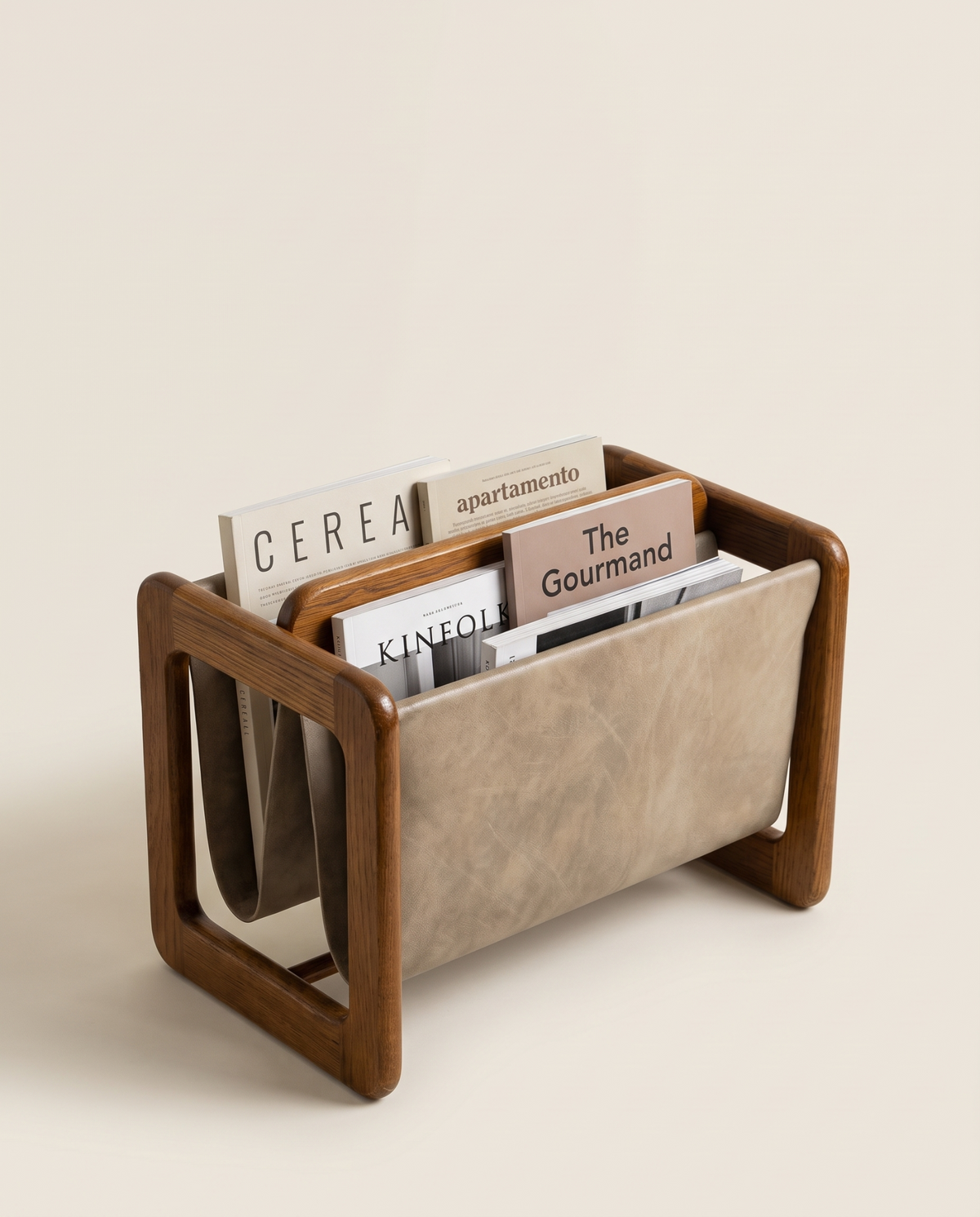 Detail of leather sling and oak frame on Danish magazine stand