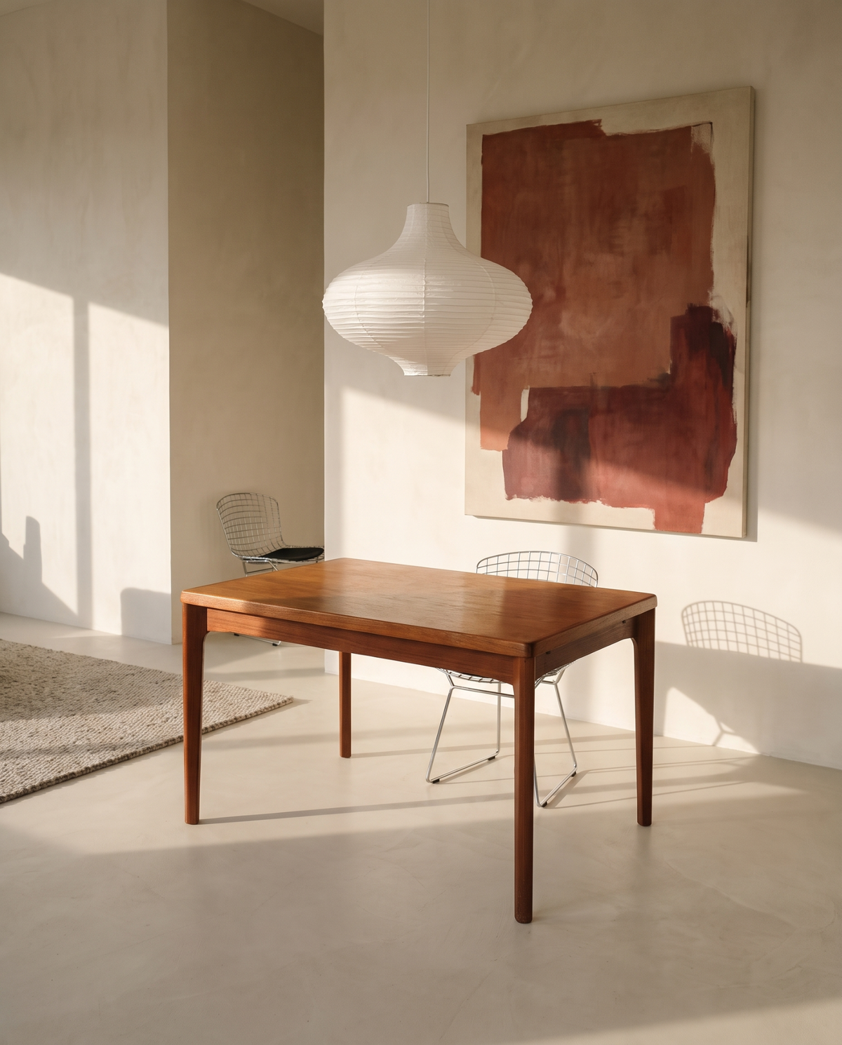 Danish teak extending dining table in a lived-in interior