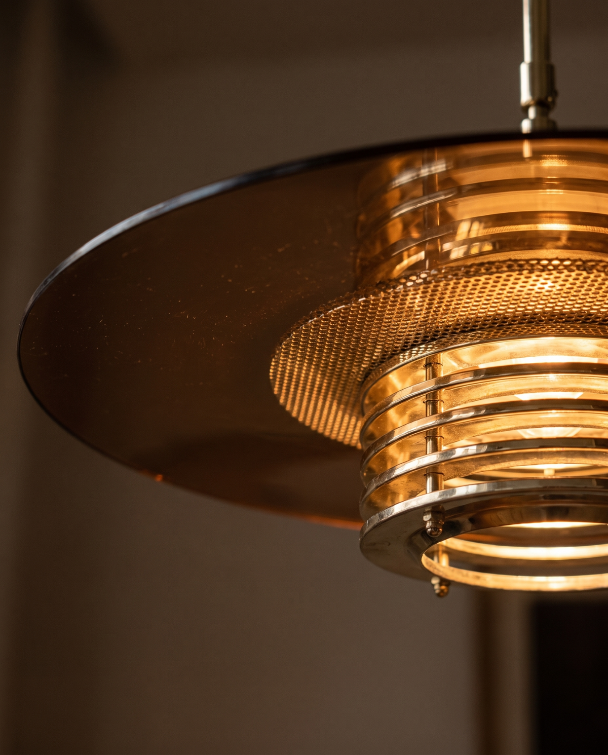 Swedish smoke glass and brass pendant in interior setting