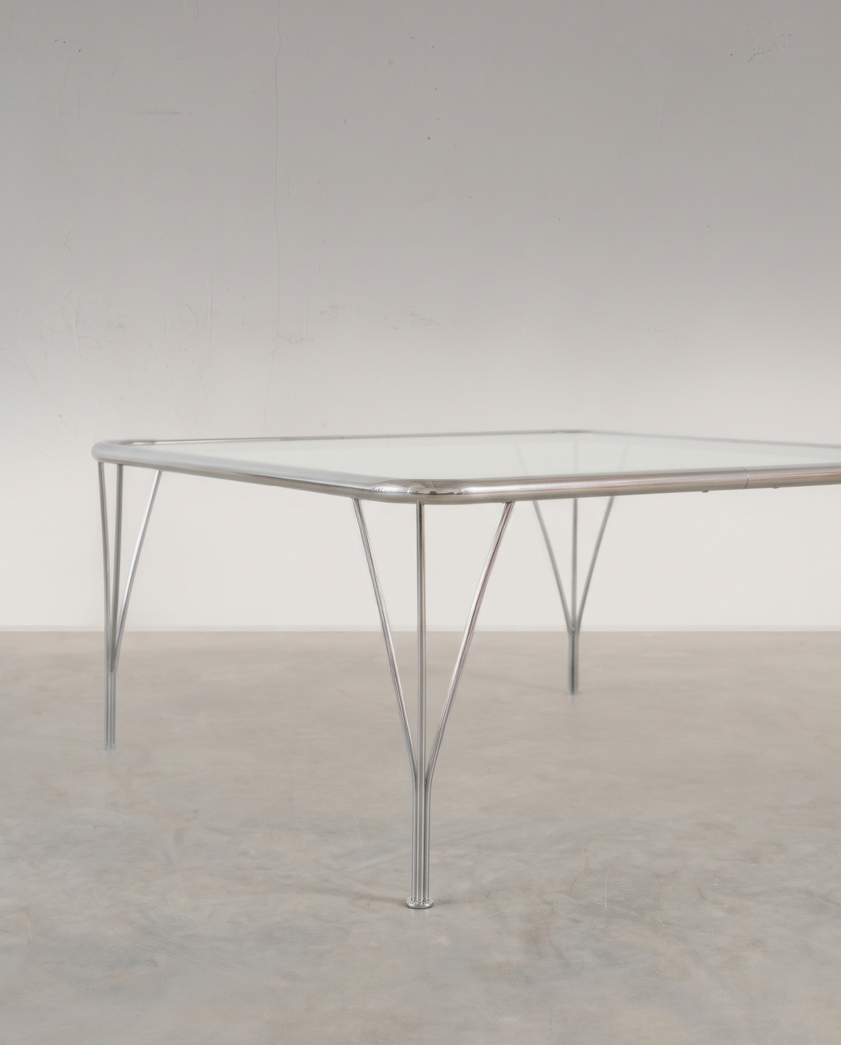Side view of vintage chrome and glass coffee table