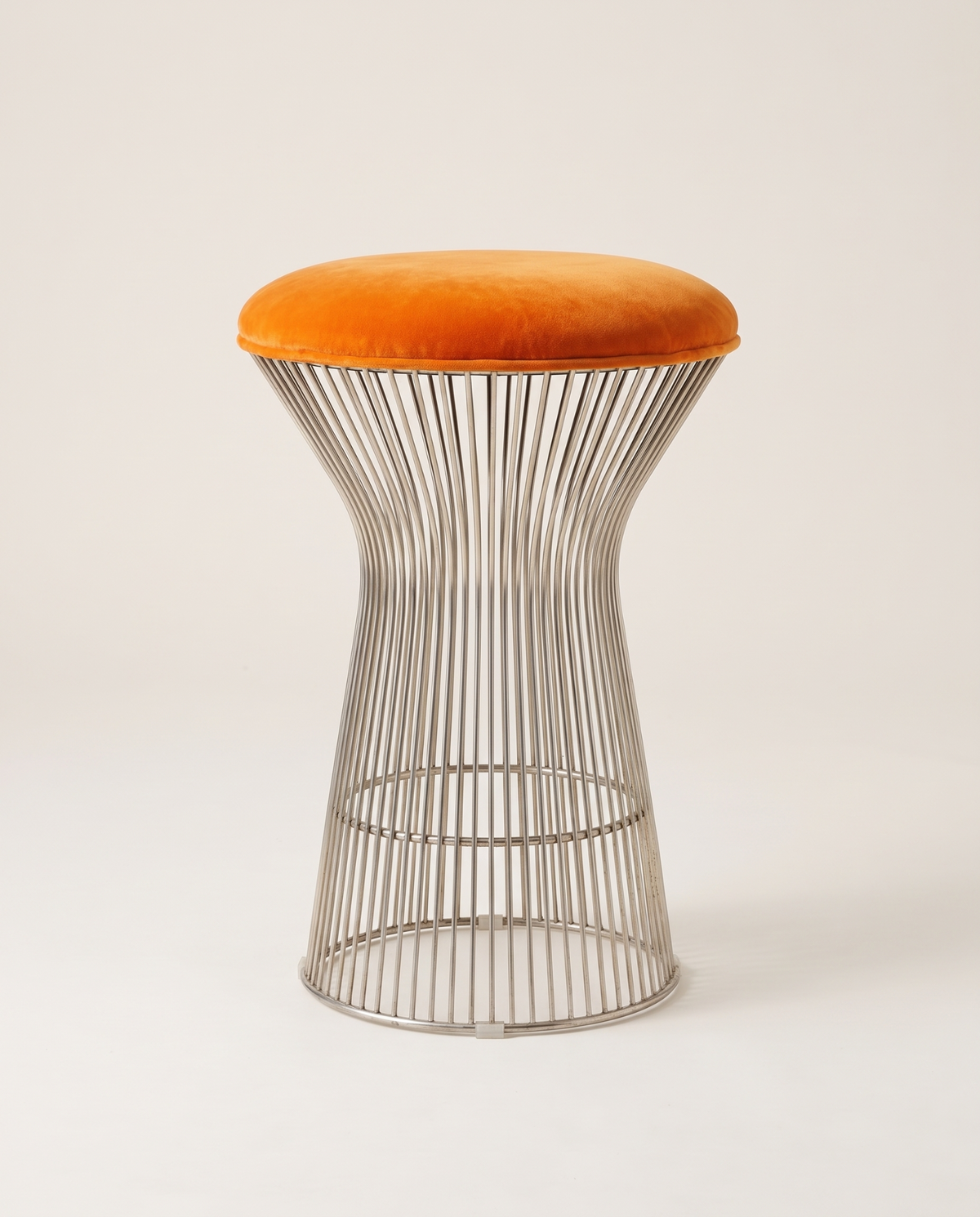 Orange velvet vintage stool with chrome wire base